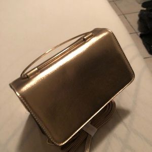 Women’s gold crossbody handbag